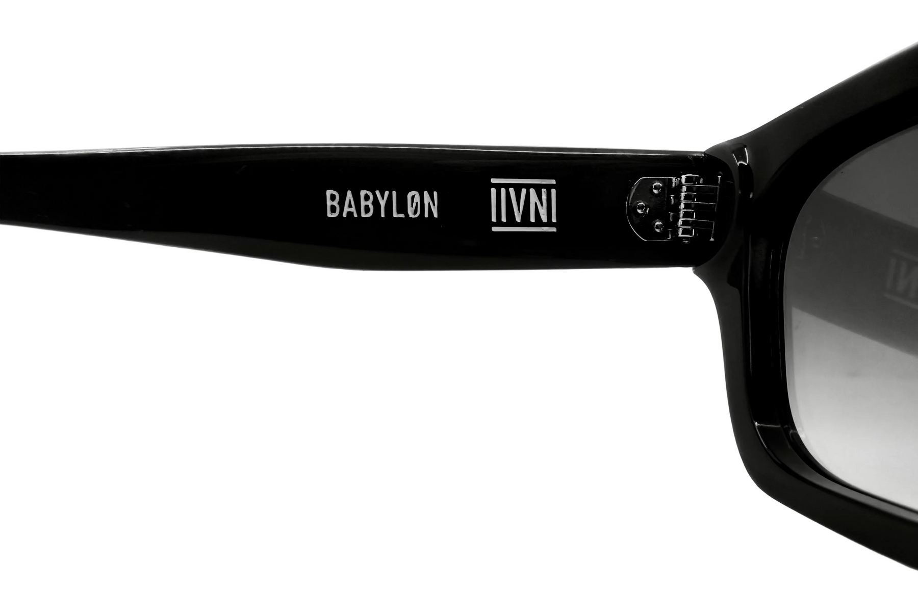 Black sunglasses with 'BABYLON' and 'IVNI' branding on the frame against a white background